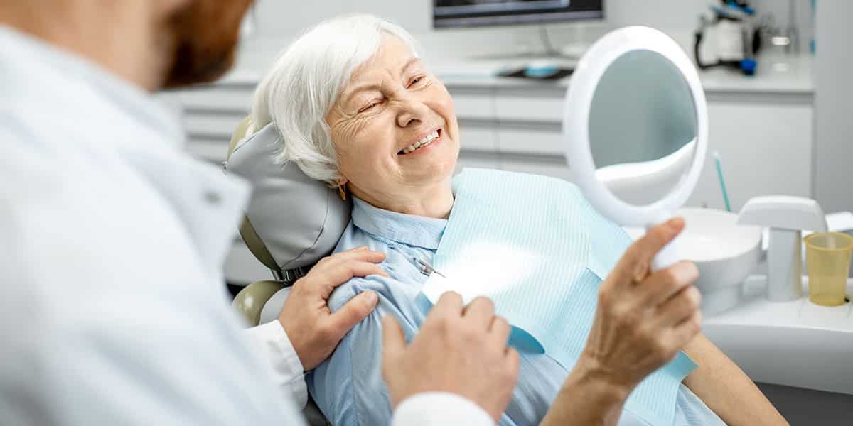 Mature Woman Smiling In Mirror