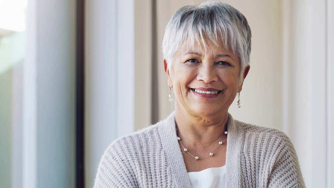 Smiling Woman in Dental Office