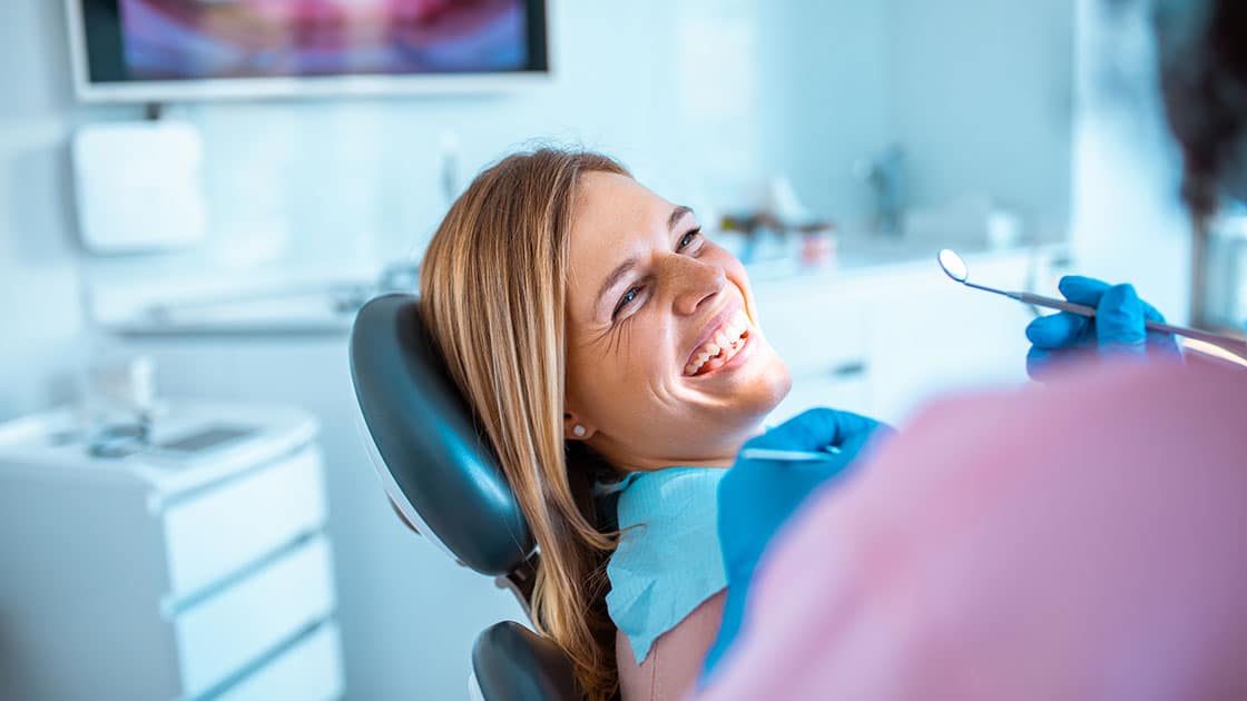 woman smiling in dentist chair